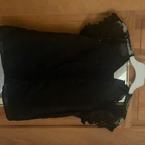 Black blouse with lace details and lace capped sleeves